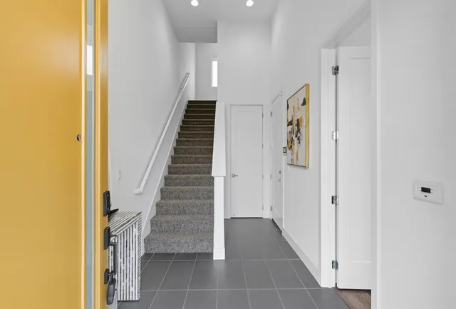 a view of a hallway with staircase