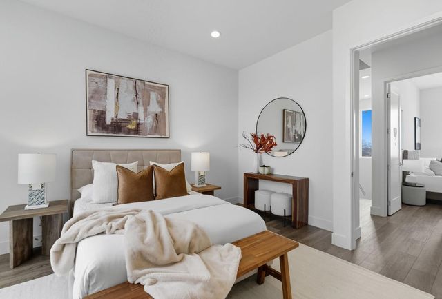 a bedroom with a bed and a chair