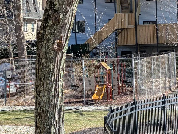 a view of swimming pool with a patio and a yard