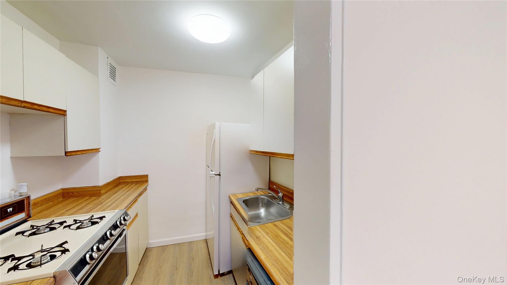 30 South Cole Avenue, Unit 6L Spring Valley, NY 10977 - Photo 6 of 13 a view of walk in closet with clothes and shoes