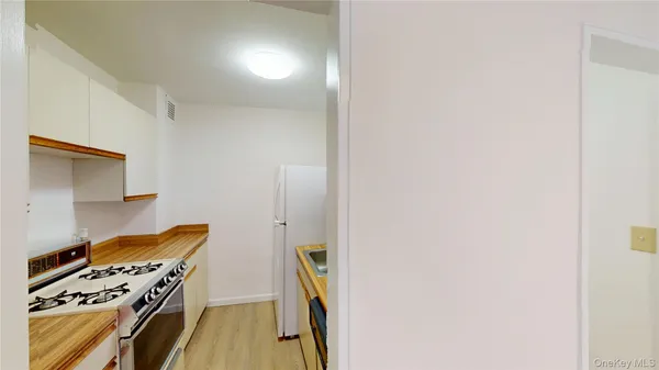 a kitchen with a stove and a refrigerator