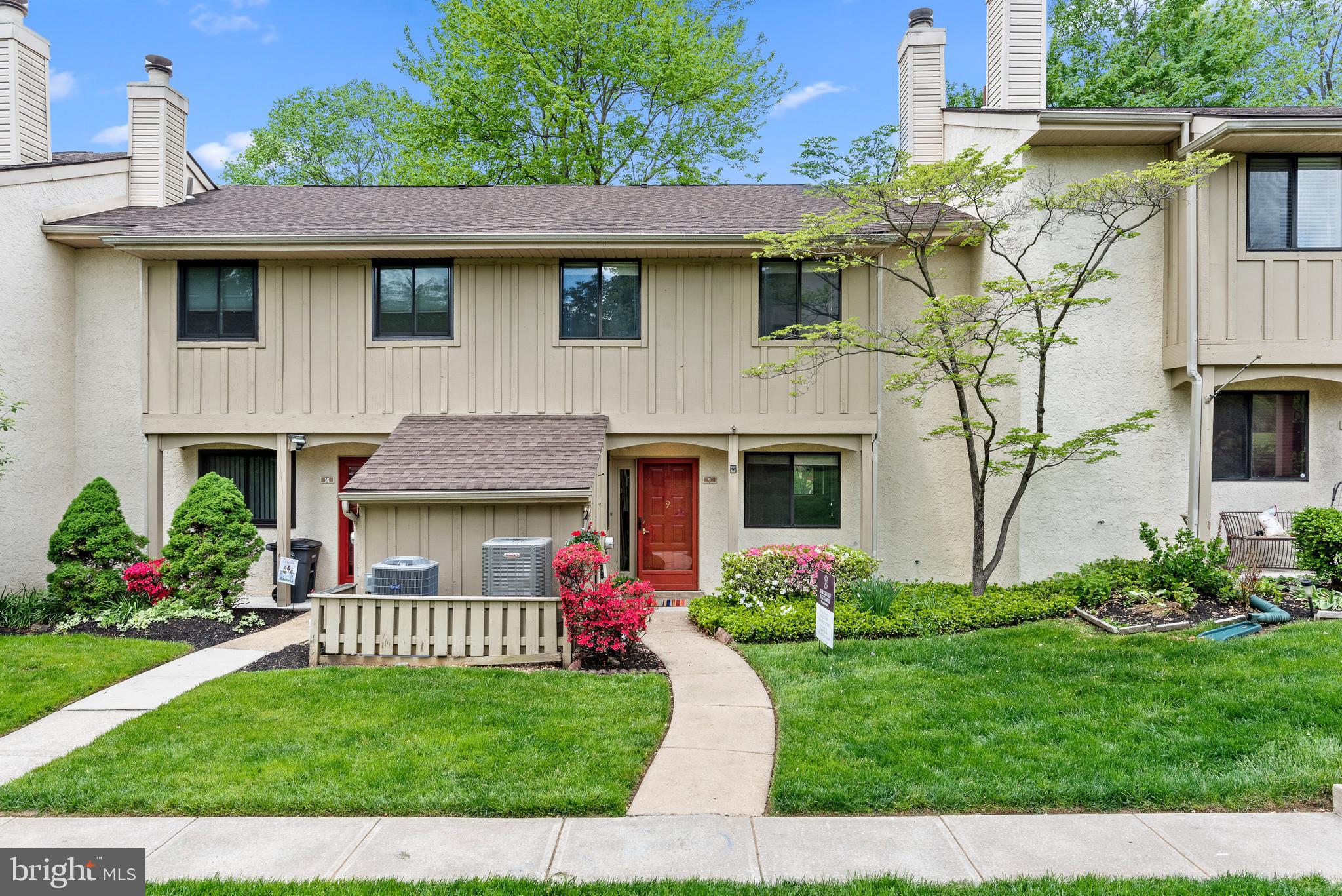 1101 Brinton Place Road, Unit 9 West Chester, PA 19380 - Photo 1 of 26 a front view of a house with a garden