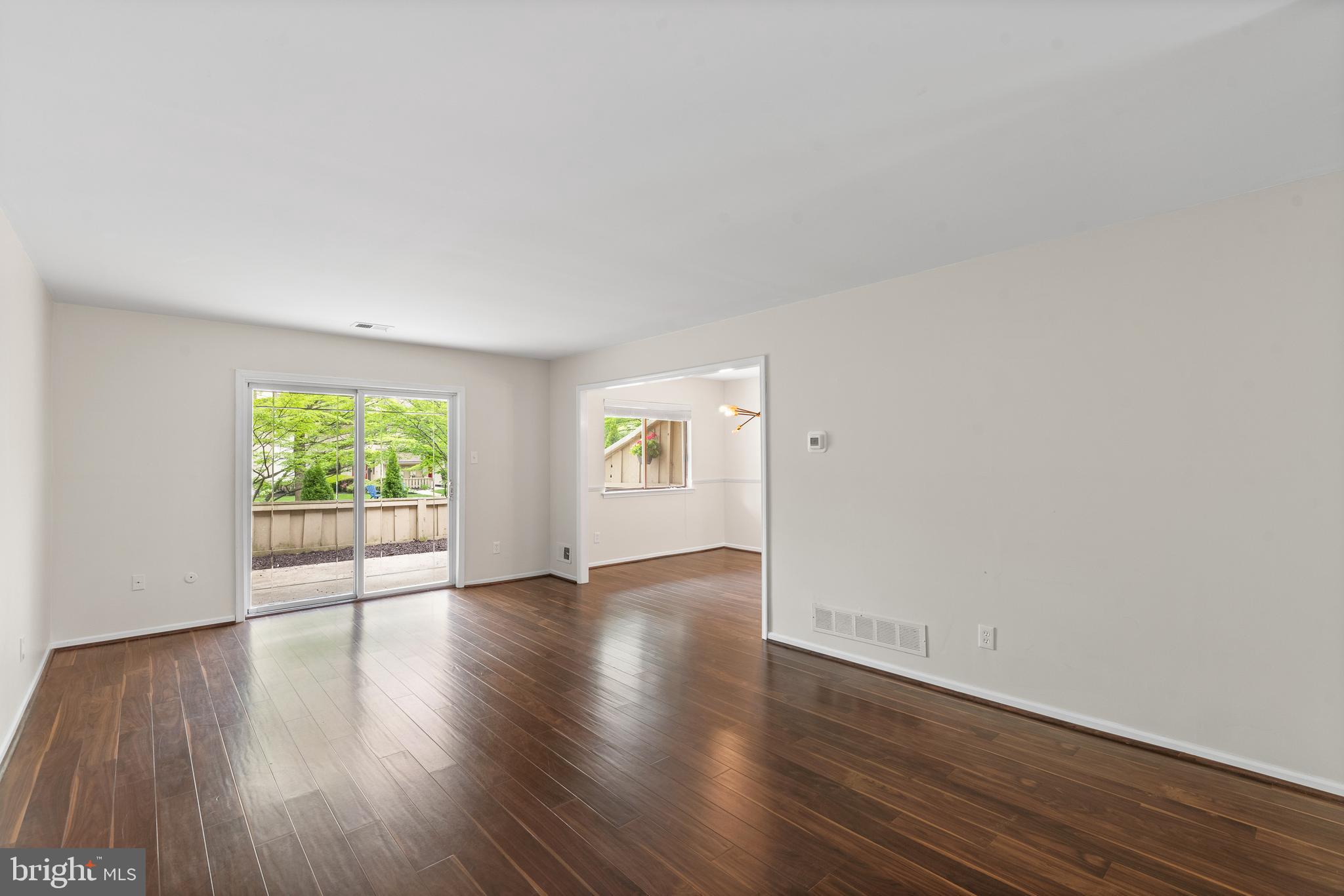 1101 Brinton Place Road, Unit 9 West Chester, PA 19380 - Photo 13 of 26 an empty room with wooden floor and windows