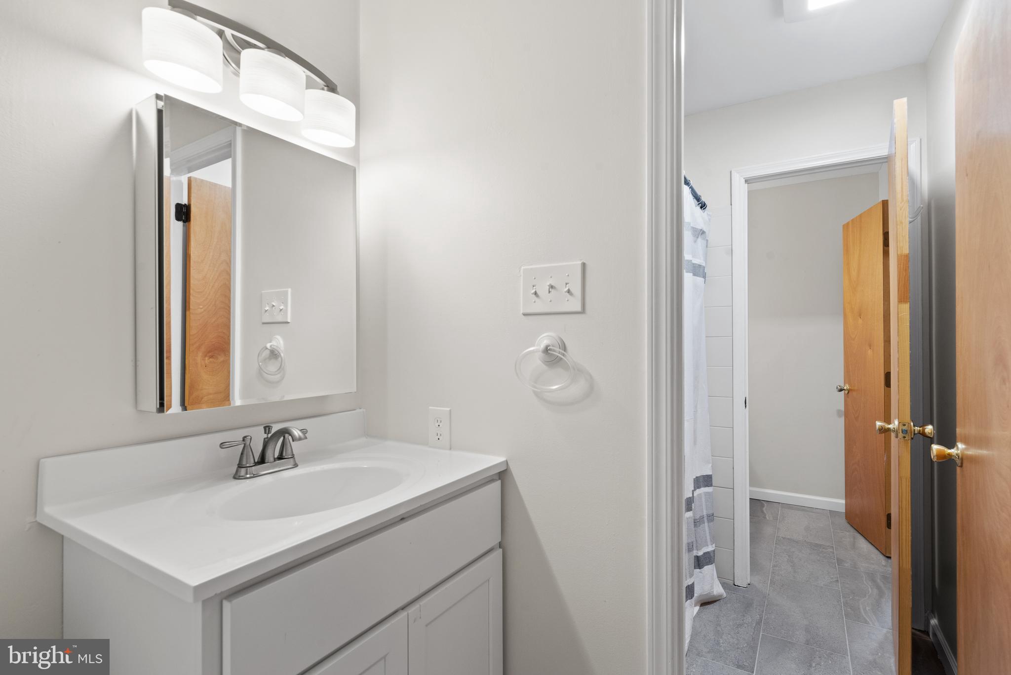 1101 Brinton Place Road, Unit 9 West Chester, PA 19380 - Photo 19 of 26 a bathroom with a sink and mirror