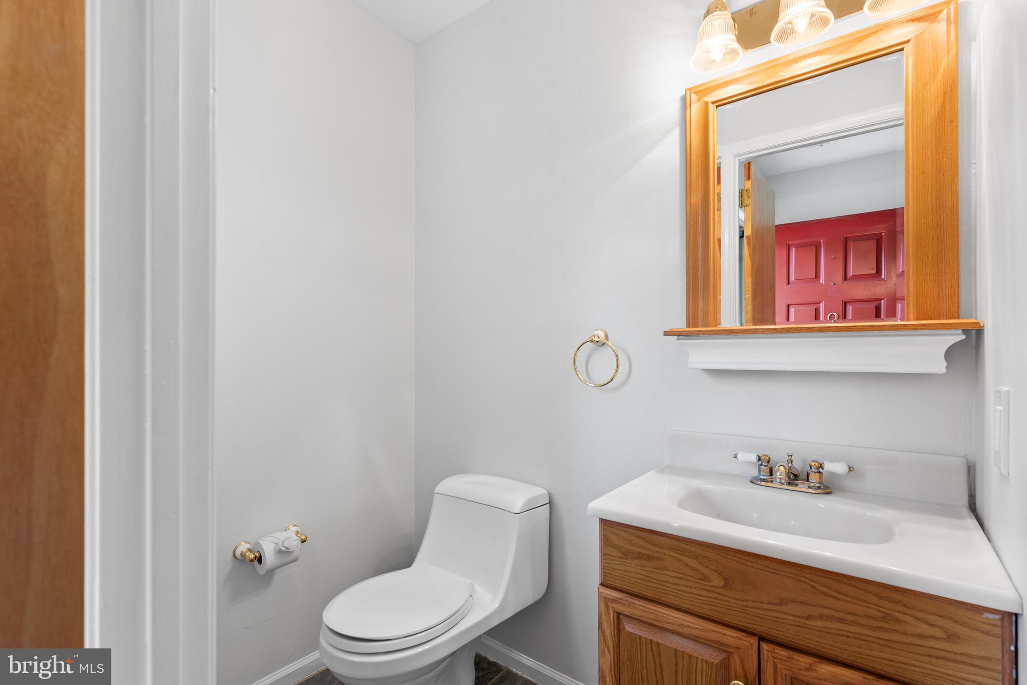 1101 Brinton Place Road, Unit 9 West Chester, PA 19380 - Photo 5 of 26 a bathroom with a toilet a sink and mirror