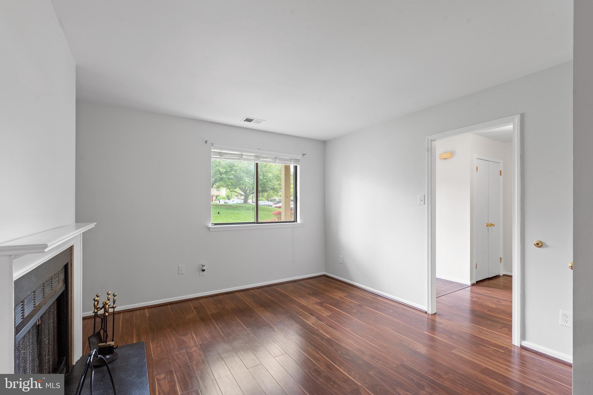 1101 Brinton Place Road, Unit 9 West Chester, PA 19380 - Photo 6 of 26 an empty room with wooden floor and a window