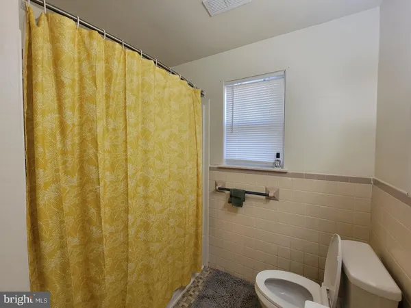 a bathroom with a shower curtain