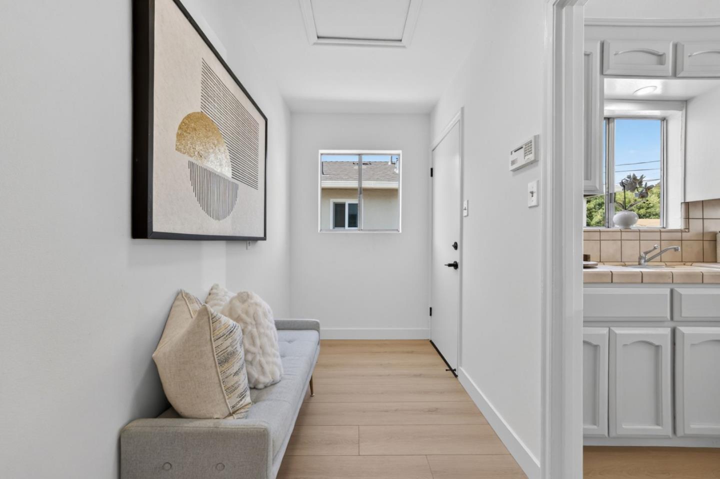 1236 Whitton Avenue San Jose, CA 95116 - Photo 11 of 30 hallway with furniture and wooden floor