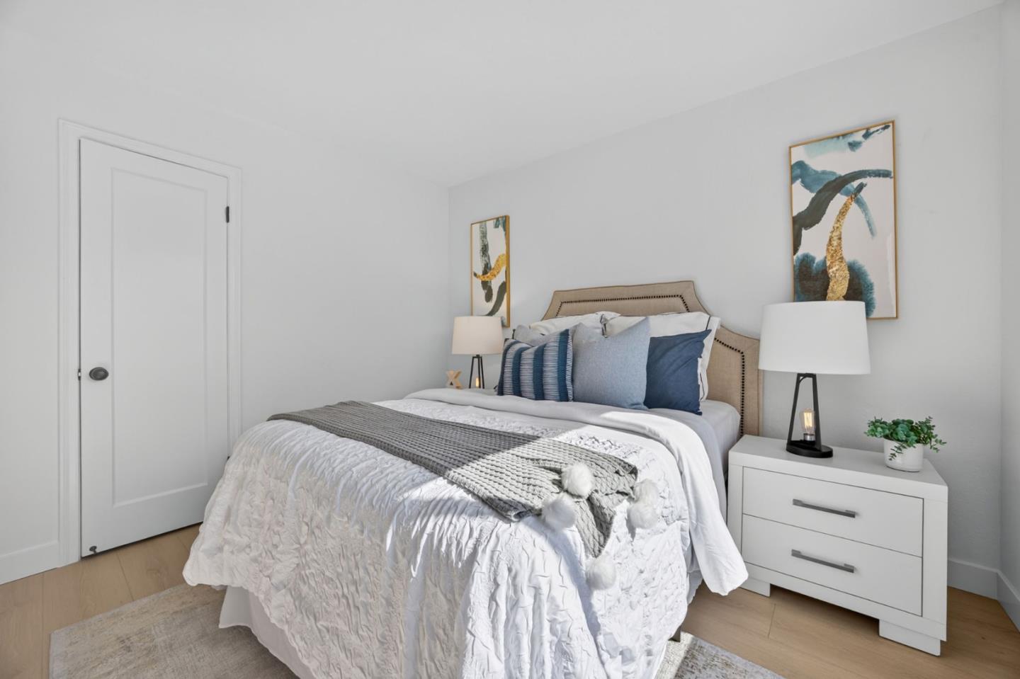 1236 Whitton Avenue San Jose, CA 95116 - Photo 14 of 30 a bed room with a bed and a night stand