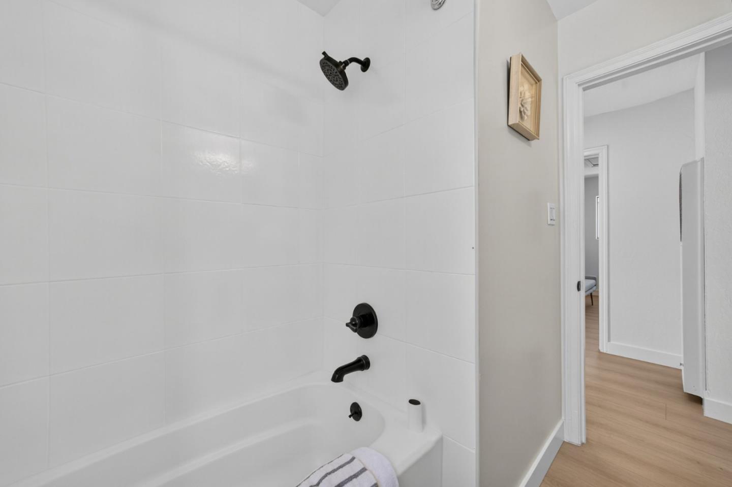 1236 Whitton Avenue San Jose, CA 95116 - Photo 16 of 30 a bathroom with a bathtub