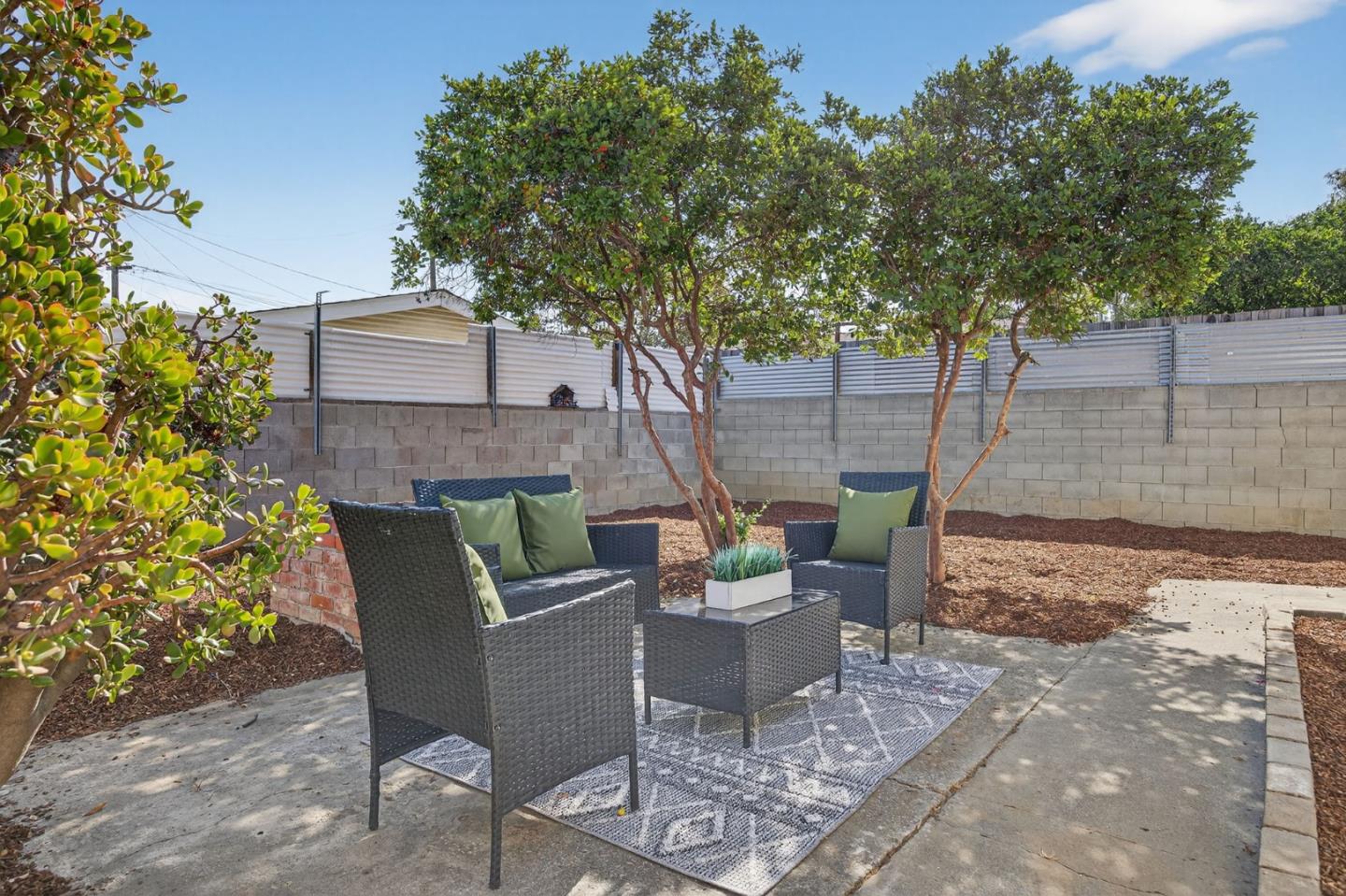 1236 Whitton Avenue San Jose, CA 95116 - Photo 23 of 30 a view of a chairs and table in backyard