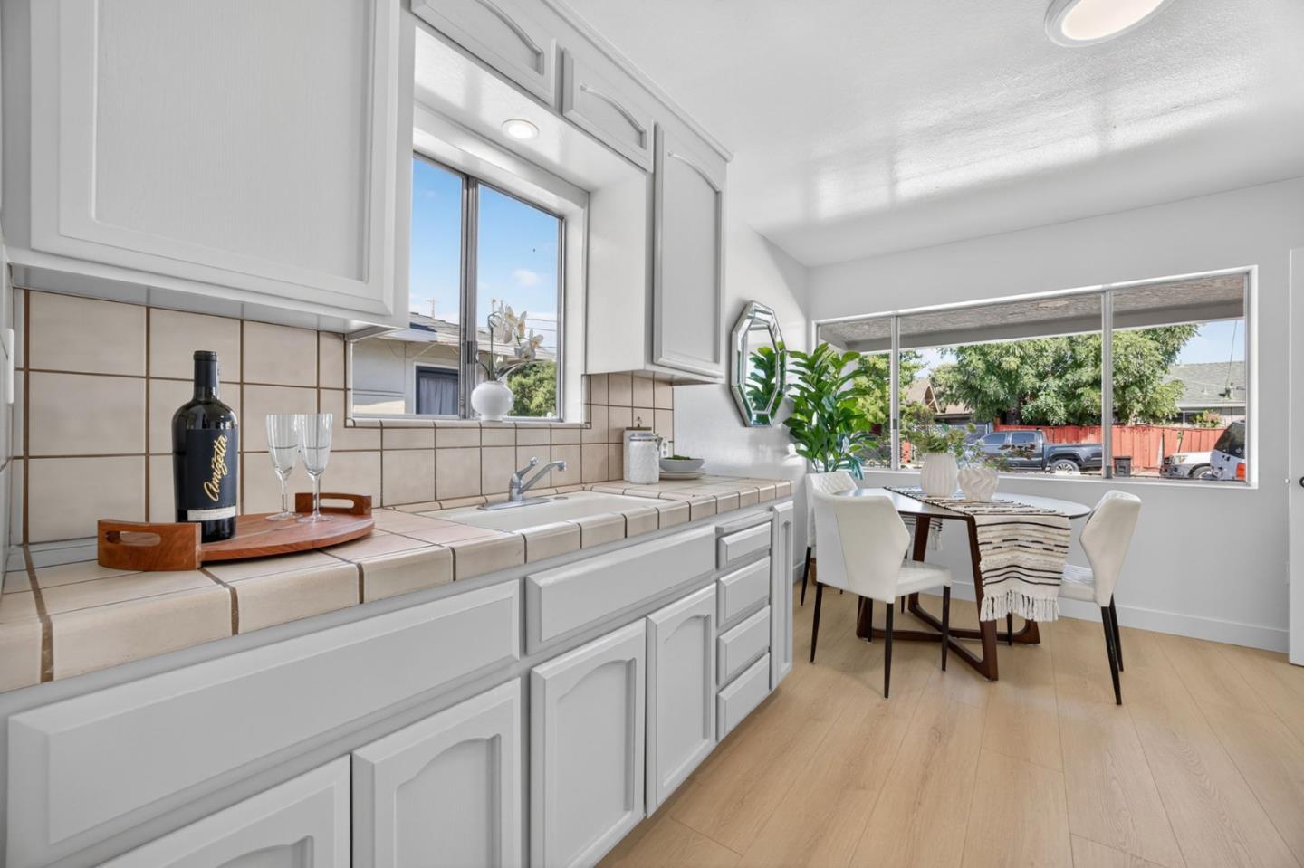 1236 Whitton Avenue San Jose, CA 95116 - Photo 7 of 30 a kitchen with a sink and a stove top oven