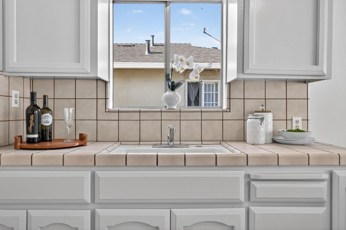 1236 Whitton Avenue San Jose, CA 95116 - Photo 8 of 30 a kitchen with a sink and cabinets