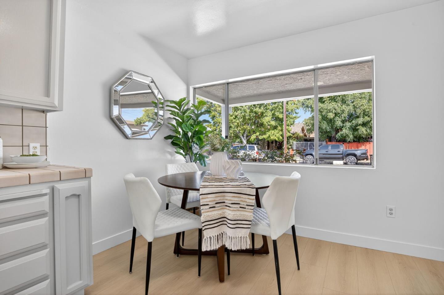 1236 Whitton Avenue San Jose, CA 95116 - Photo 9 of 30 a dining room with furniture and window
