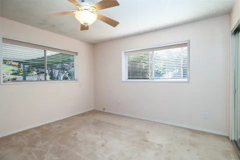 a bathroom with a sink and mirror with toilet