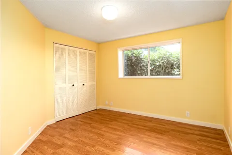 an aerial view of a house with a yard and garden
