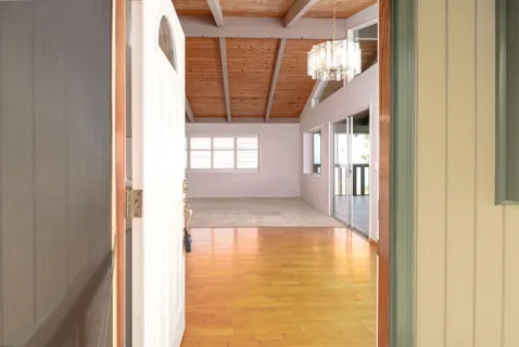 a view of an empty room with a window