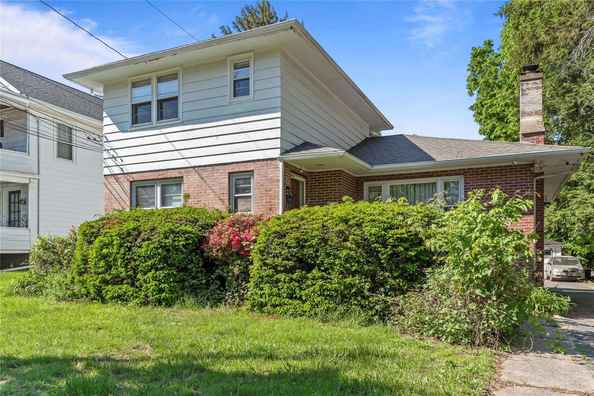 17 College Avenue, Unit 2 Poughkeepsie, NY 12603 - Photo 1 of 12 a front view of a house with a yard