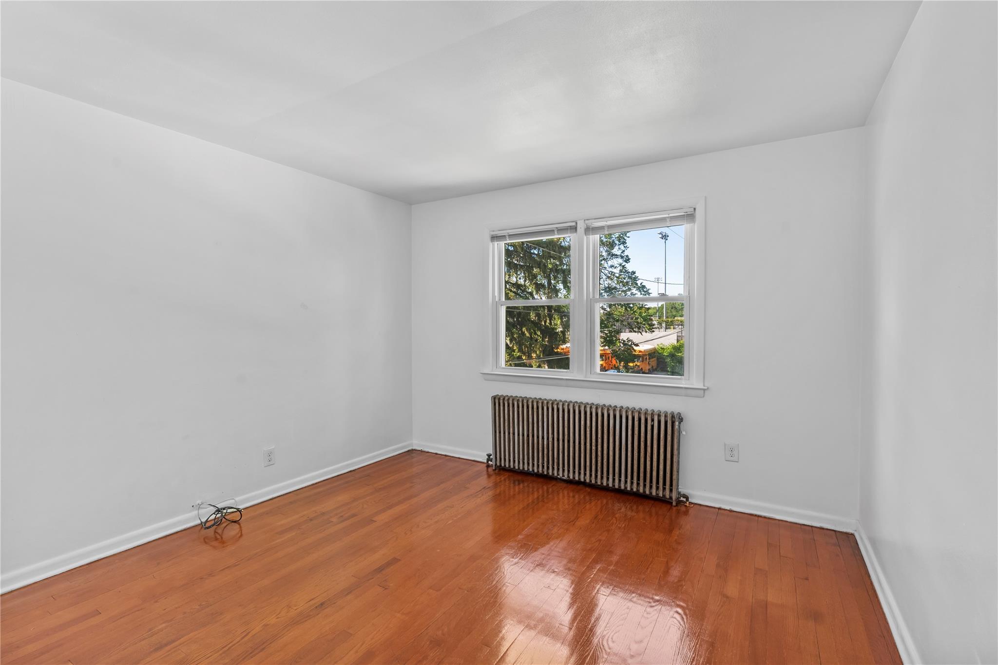 17 College Avenue, Unit 2 Poughkeepsie, NY 12603 - Photo 6 of 12 an empty room with a window
