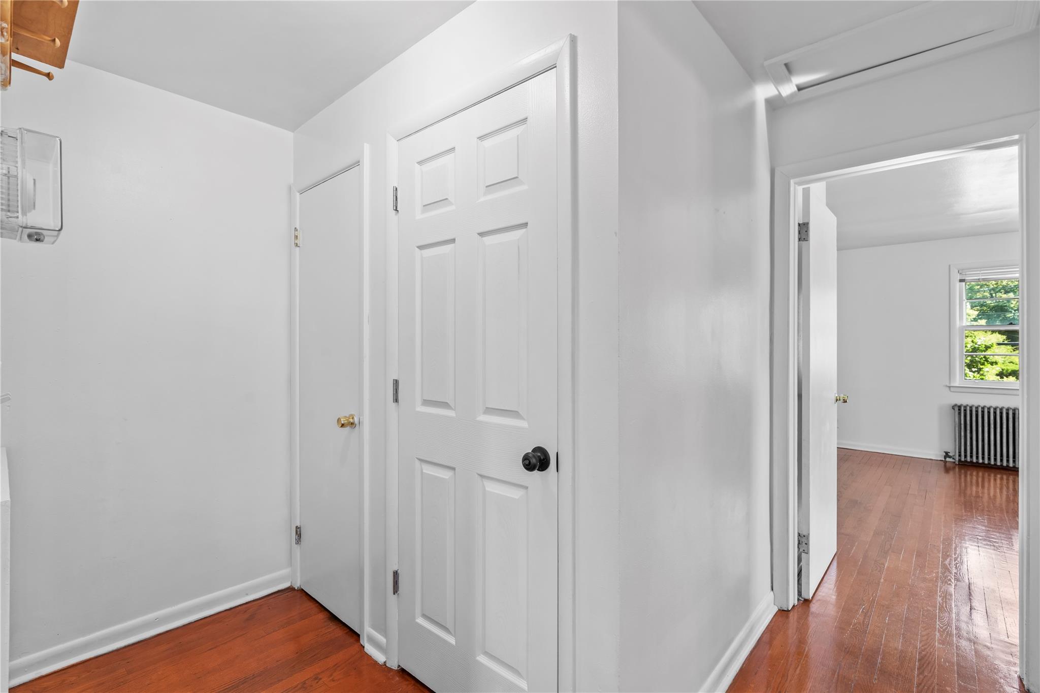 17 College Avenue, Unit 2 Poughkeepsie, NY 12603 - Photo 8 of 12 a view of a hallway with wooden floor and closet area