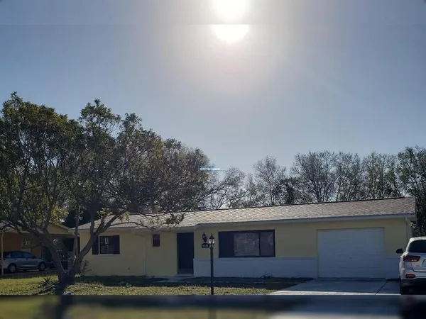 a view of house with trees in the background