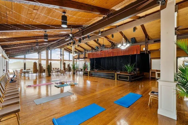 a view of a swimming pool with outdoor seating