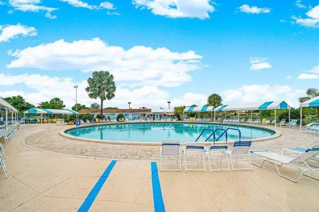 a view of a swimming pool with a lounge chair