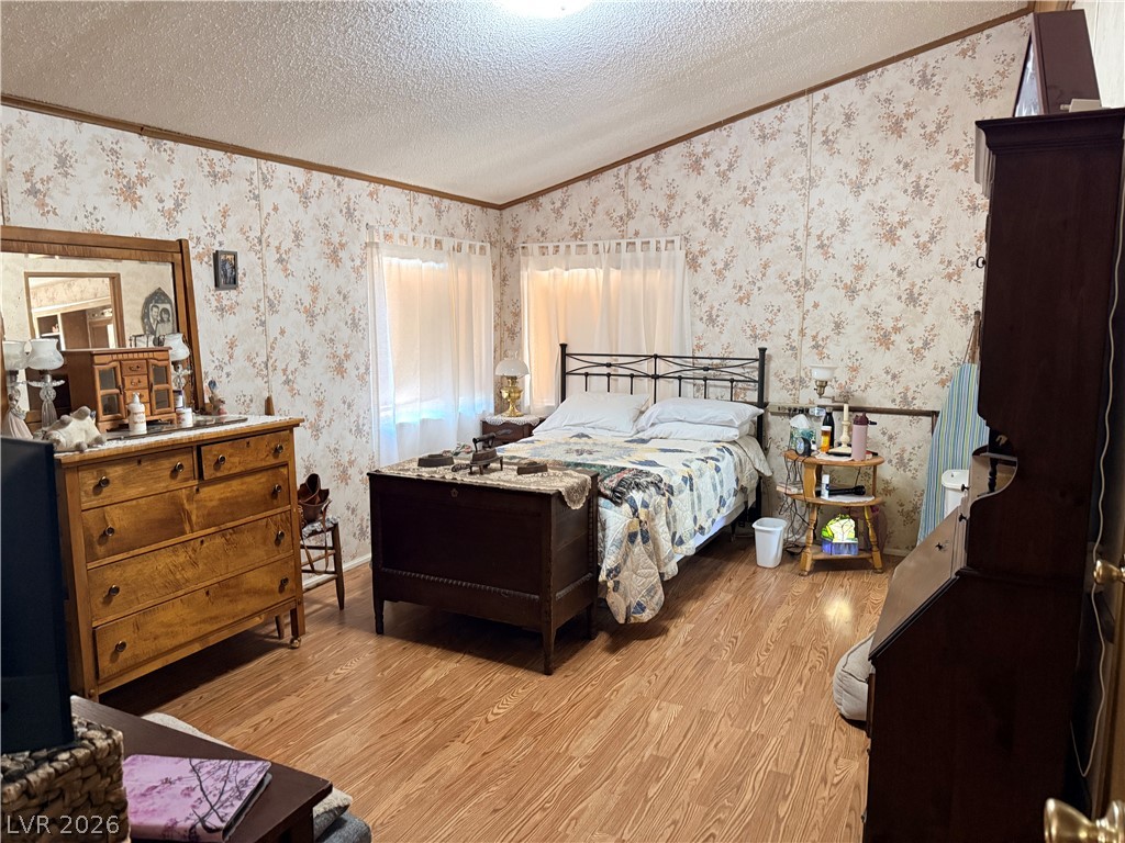 1391 West Dyer Road Pahrump, NV 89048 - Photo 35 of 50 Hardwood-style flooring extends across this bright and well-lit private retreat.