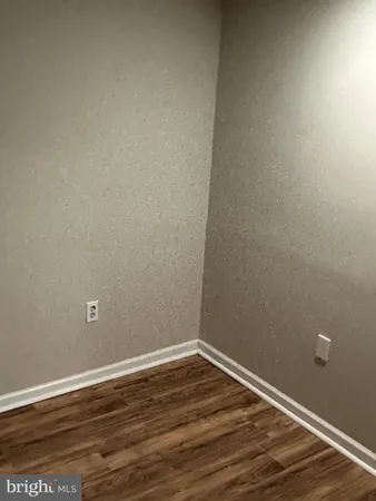 a view of a livingroom with wooden floor