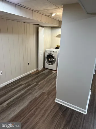 a view of a livingroom with wooden floor