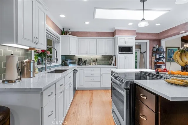 a utility room with sink dryer and washer
