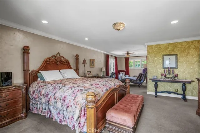 a bed room with a bed and a chair