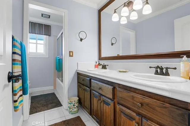 a bathroom with a sink a vanity and a mirror