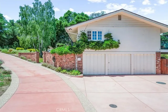 a house view with a garden space