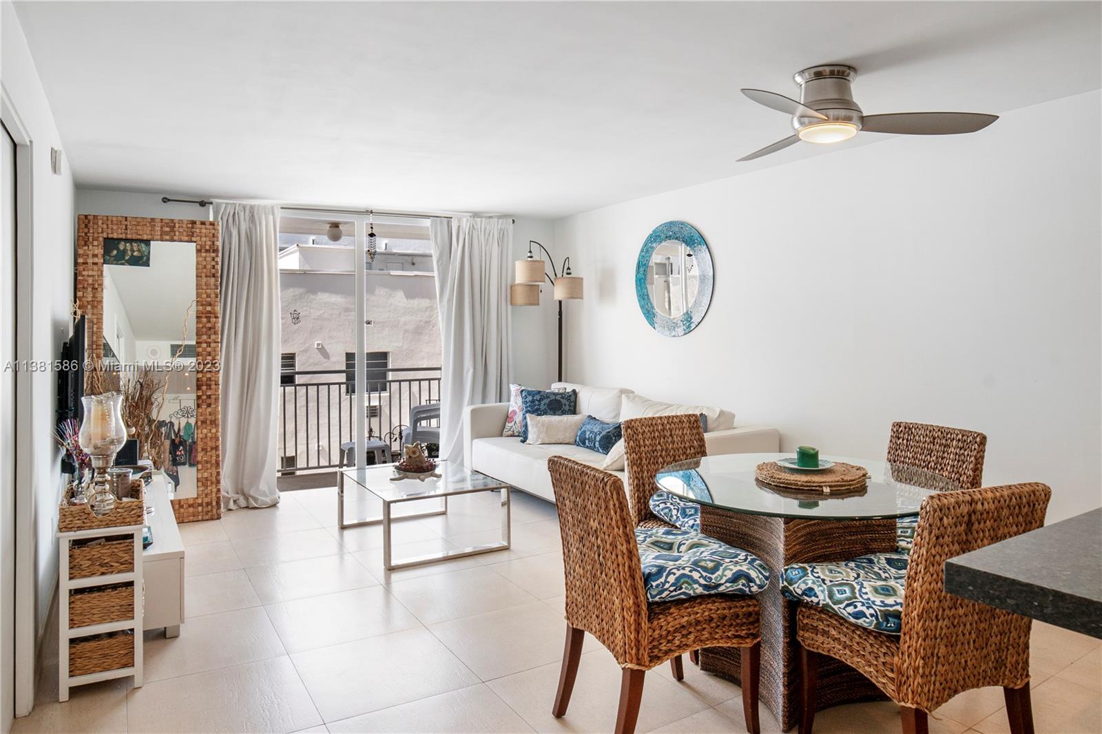 345 Ocean Drive, Unit 410 Miami Beach, FL 33139 - Photo 1 of 18 a dining room with furniture and a clock