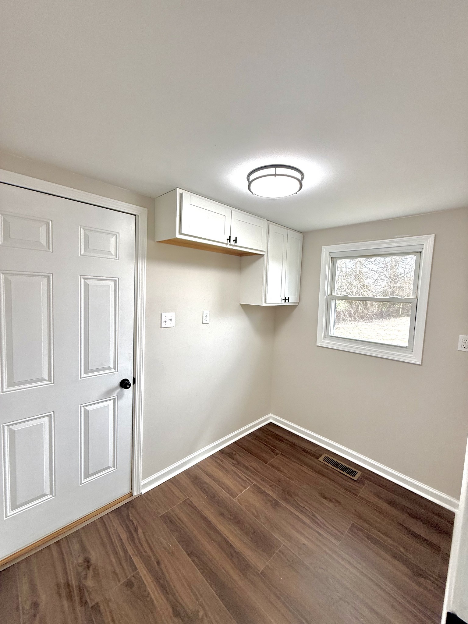 141 Main Street Gracey, KY 42232 - Photo 11 of 16 a view of empty room with wooden floor and fan