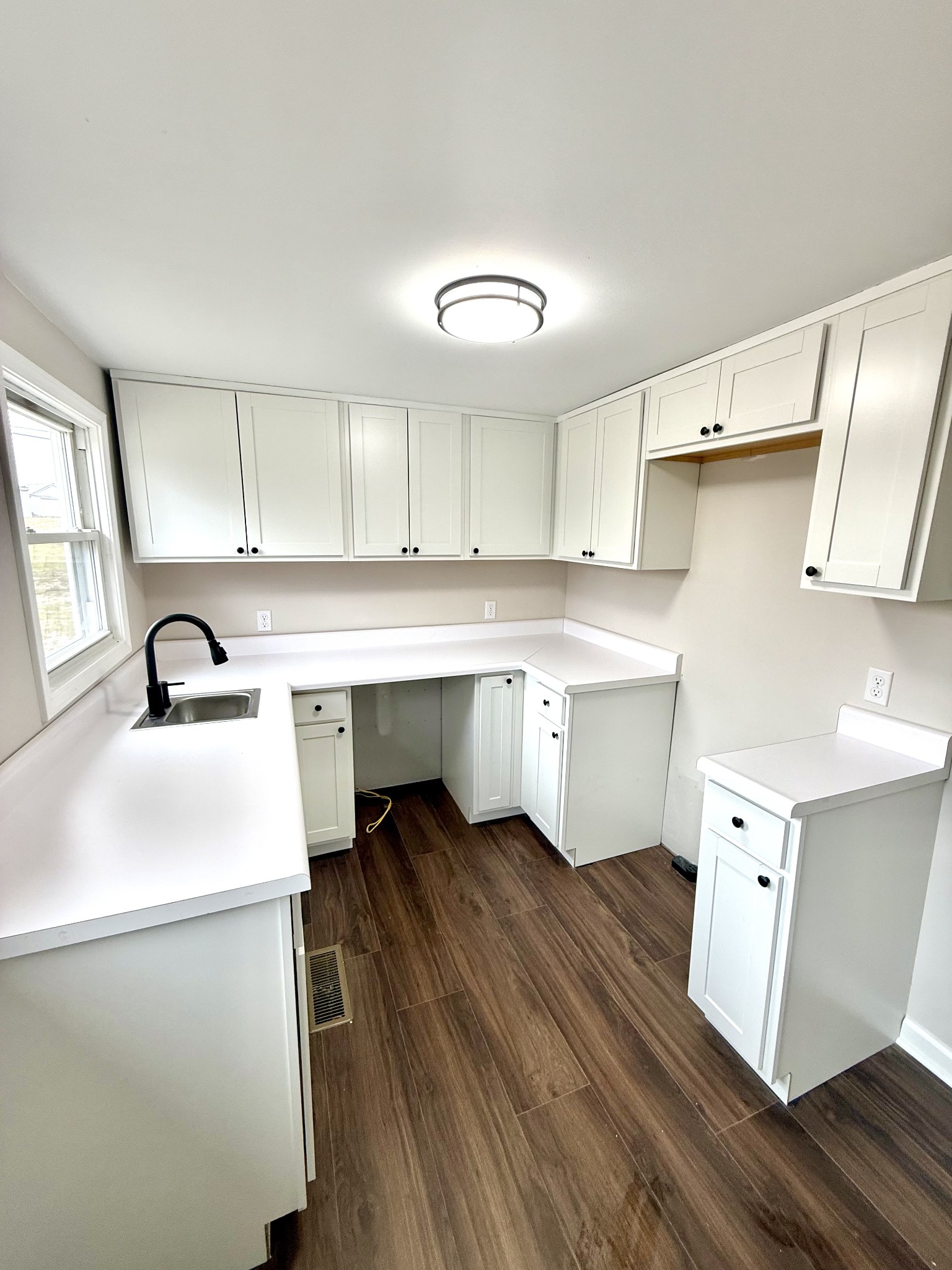 141 Main Street Gracey, KY 42232 - Photo 4 of 16 a kitchen with a sink appliances and cabinets