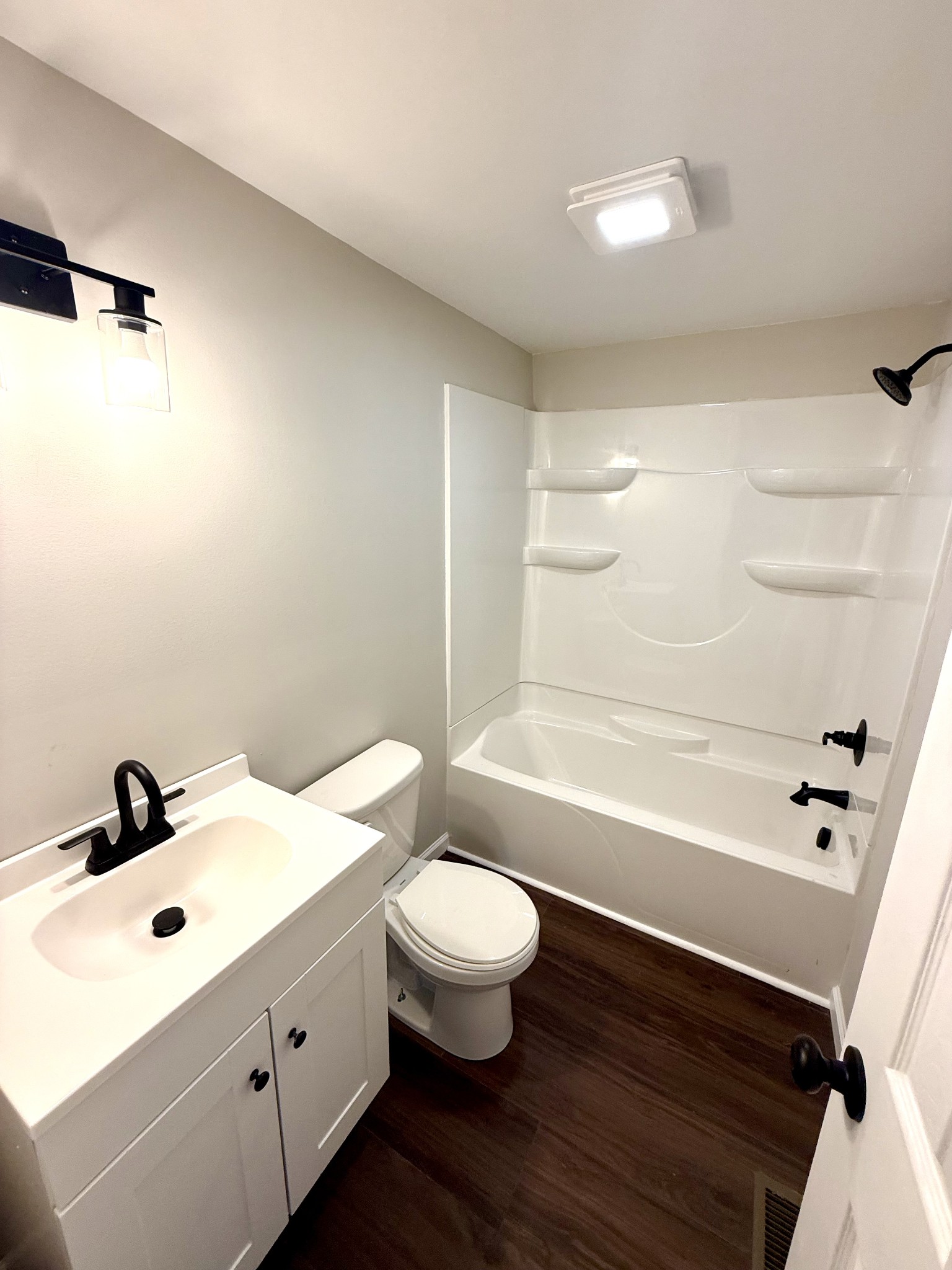 141 Main Street Gracey, KY 42232 - Photo 7 of 16 a bathroom with a sink a toilet a tub and shower