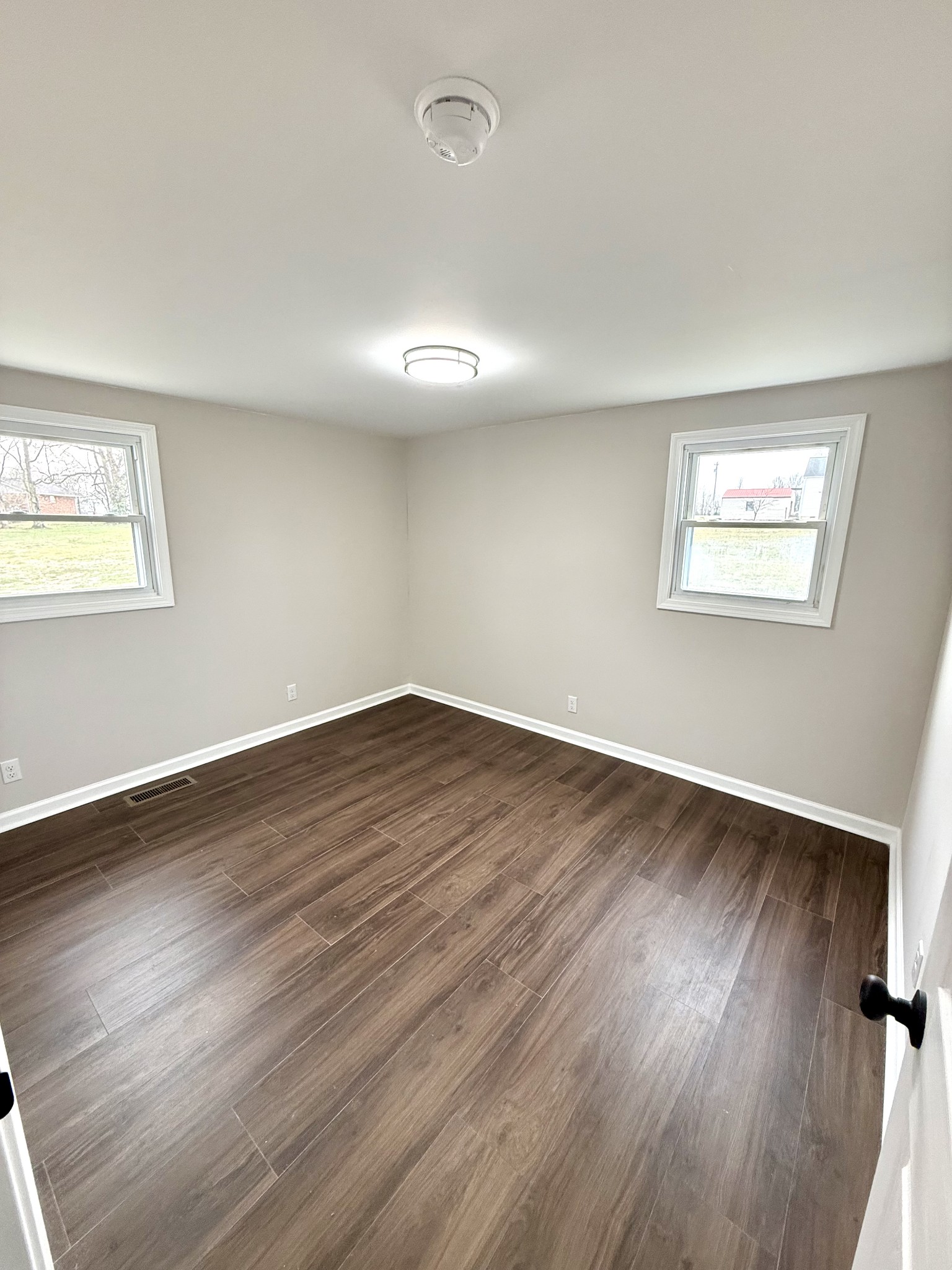 141 Main Street Gracey, KY 42232 - Photo 8 of 16 a view of empty room with wooden floor and fan