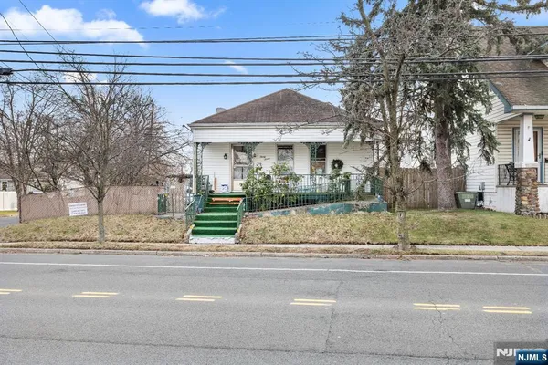 a view of a house with a street