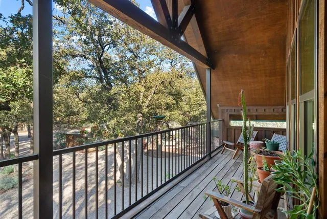 a view of balcony with wooden floor