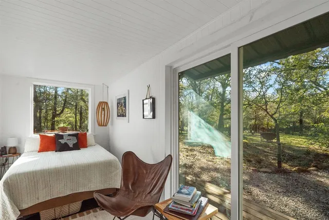 a view of a chairs and table in patio