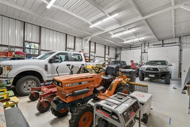 a view of house with backyard and seating space