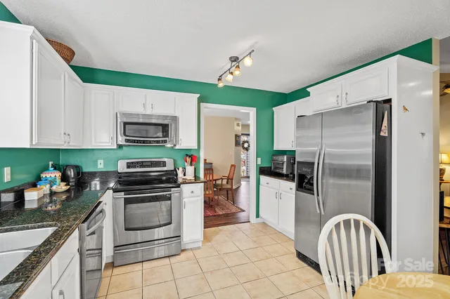 a kitchen with sink cabinets and window