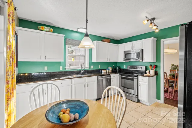 a dining room with furniture and window