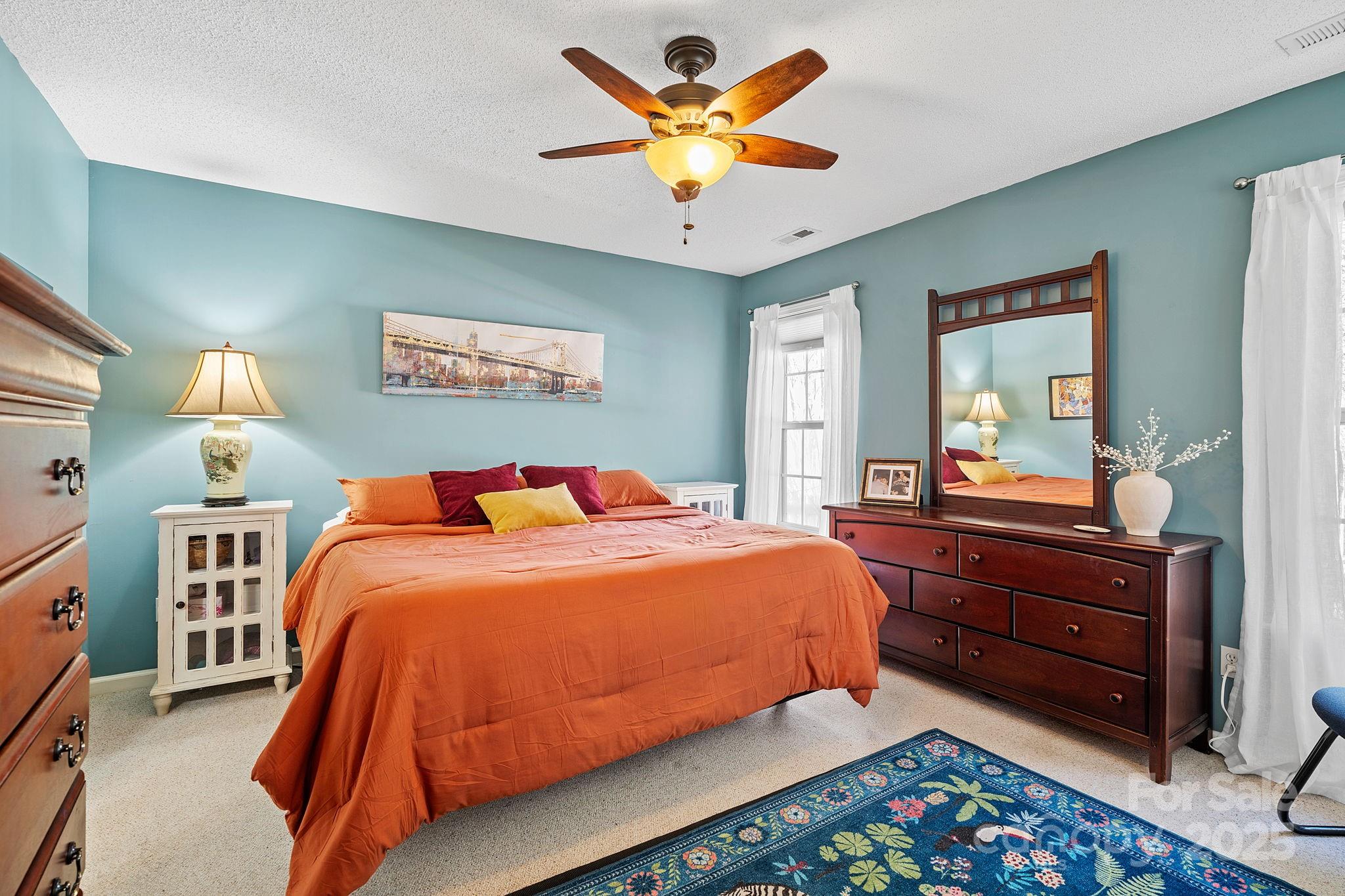 28 Sand Pebble Court Fletcher, NC 28732 - Photo 15 of 35 a bedroom with bed and wooden furniture