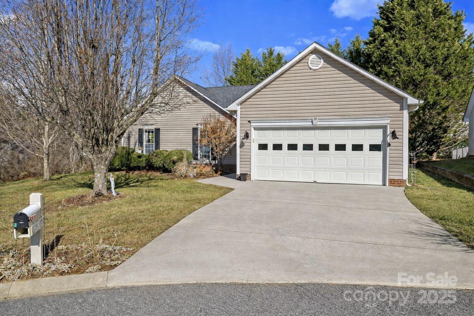 28 Sand Pebble Court Fletcher, NC 28732 - Photo 2 of 35 front view of a house with a yard