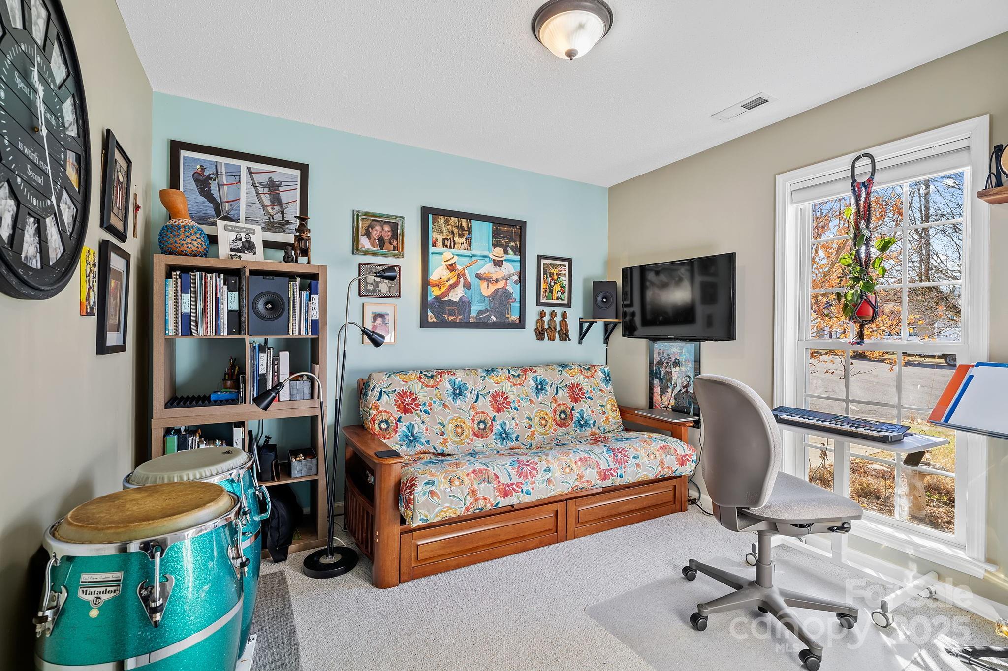 28 Sand Pebble Court Fletcher, NC 28732 - Photo 21 of 35 a bedroom with furniture and a flat screen tv