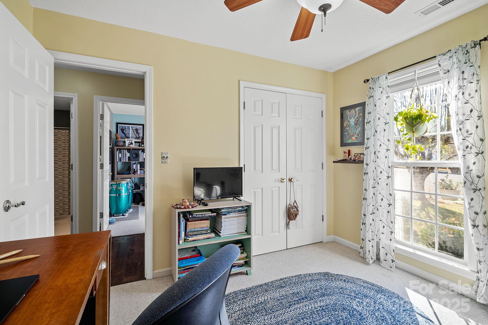 28 Sand Pebble Court Fletcher, NC 28732 - Photo 25 of 35 a view of a workspace with furniture and a window