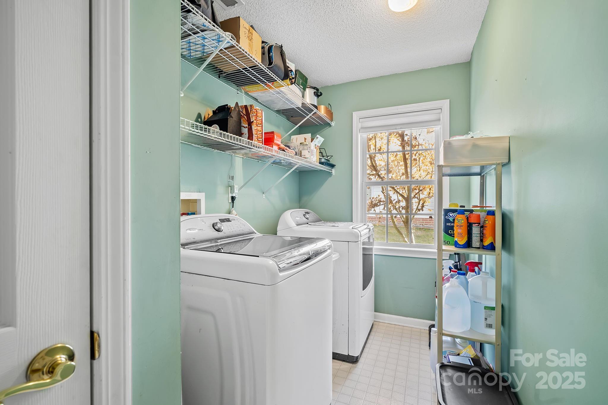 28 Sand Pebble Court Fletcher, NC 28732 - Photo 26 of 35 a utility room with dryer and washer